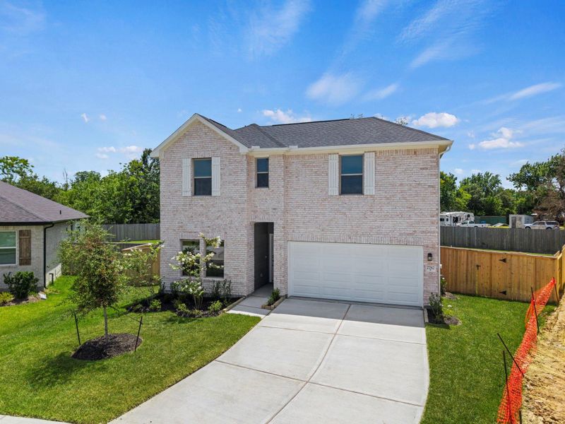 Front exterior of a new home in Laurel Landing, Alvin, TX, highlighting curb appeal (Image 2). Front exterior of a new home in Laurel Landing, Alvin, TX, highlighting curb appeal (Image 2).