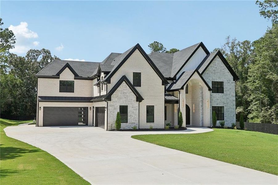 Front exterior of a new home in , Hoschton, GA, highlighting curb appeal (Image 27). Front exterior of a new home in , Hoschton, GA, highlighting curb appeal (Image 27).