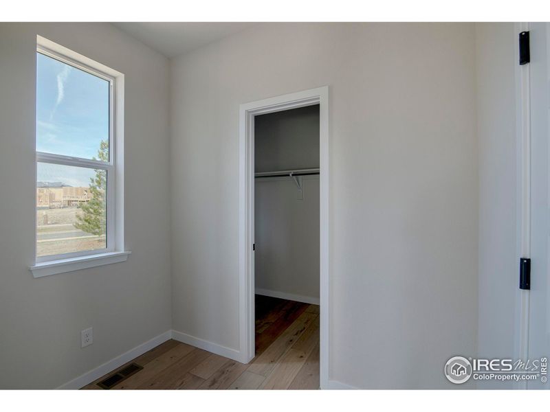 Enter from the garage into the mudroom with walk in closet