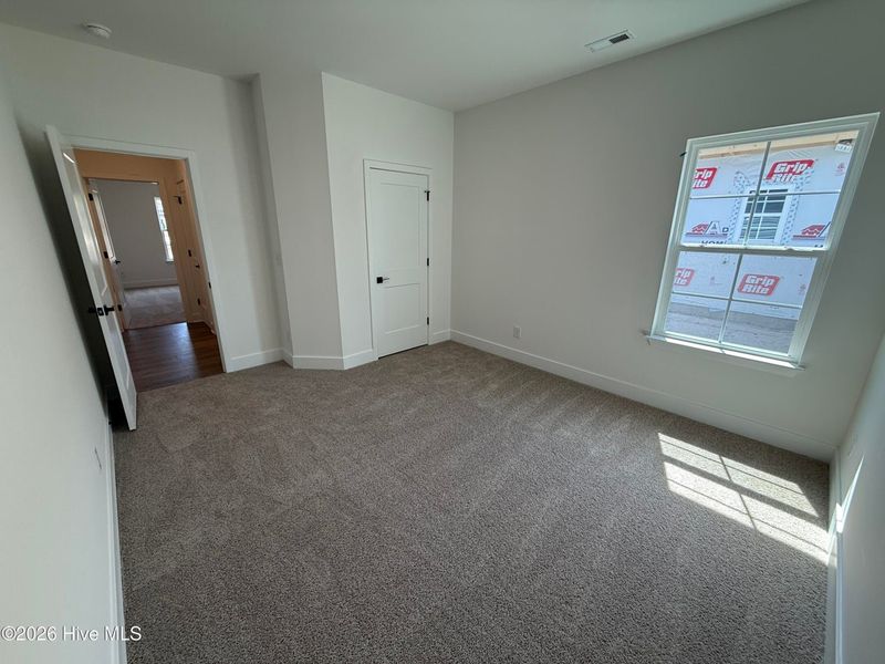 Spacious, unfurnished interior of a new home in Wood Creek Landing, Leland (Image 28).