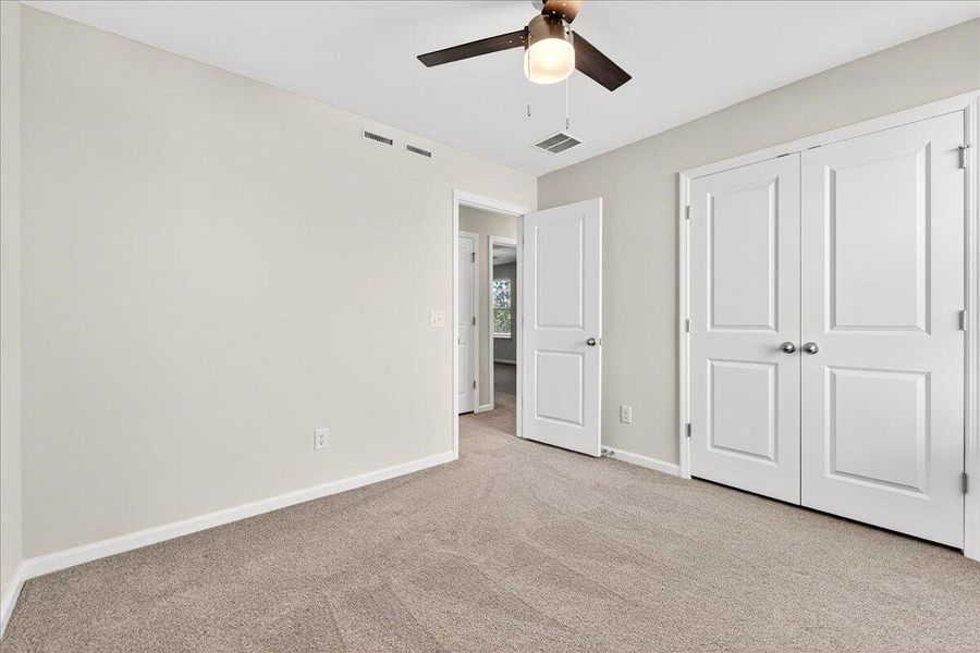 Spacious, unfurnished interior of a new home in Jasmine Point at Lakes of Cane Bay, Summerville (Image 18).