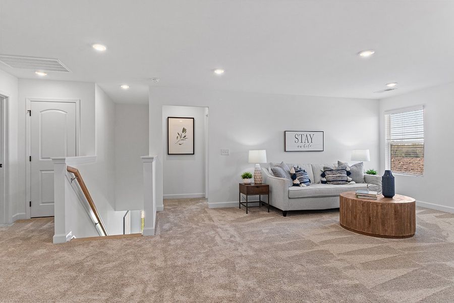 A living room with a couch and a table.