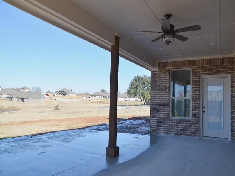 View of patio featuring ceiling fan