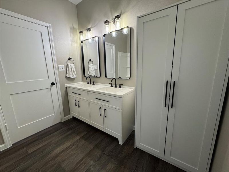 Primary bathroom - double sinks and large storage cabinet