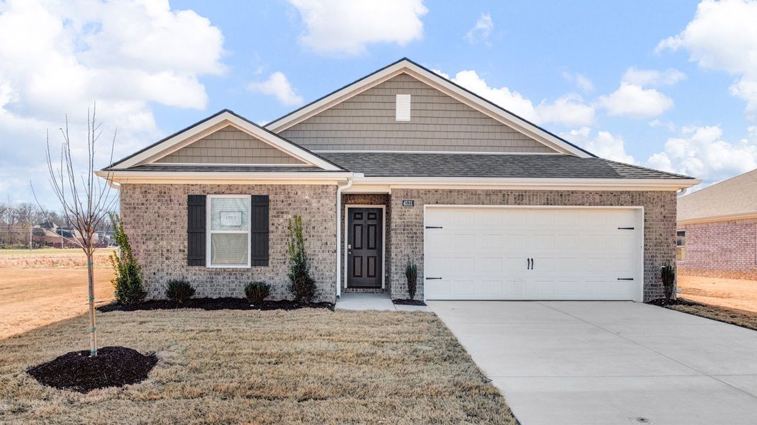 Front exterior of a new home in Riggs Pointe, Millington, TN, highlighting curb appeal (Image 2).