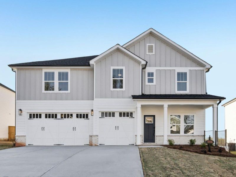 Front exterior of a new home in Vines at Mill Creek - Legacy Series, Braselton, GA, highlighting curb appeal (Image 1). Front exterior of a new home in Vines at Mill Creek - Legacy Series, Braselton, GA, highlighting curb appeal (Image 1).