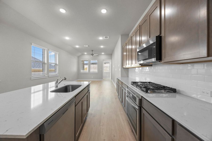 Kitchen in the Cedar home plan by Trophy Signature Homes – REPRESENTATIVE PHOTO