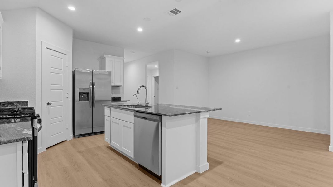 Furnished interior view inside a new home in Caldwell Crossing, Iowa Colony (Image 6).