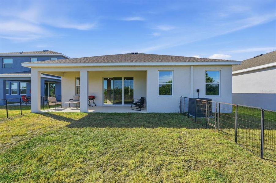 Exterior details and patio area of a home in Silverstone North, Palmetto (Image 26).