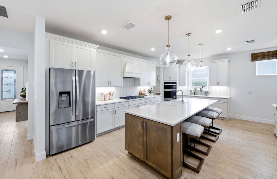 Representative furnished interior of a home built from the Palmary by DiVosta in BeachWalk by Manasota Key, Englewood (Image 9).