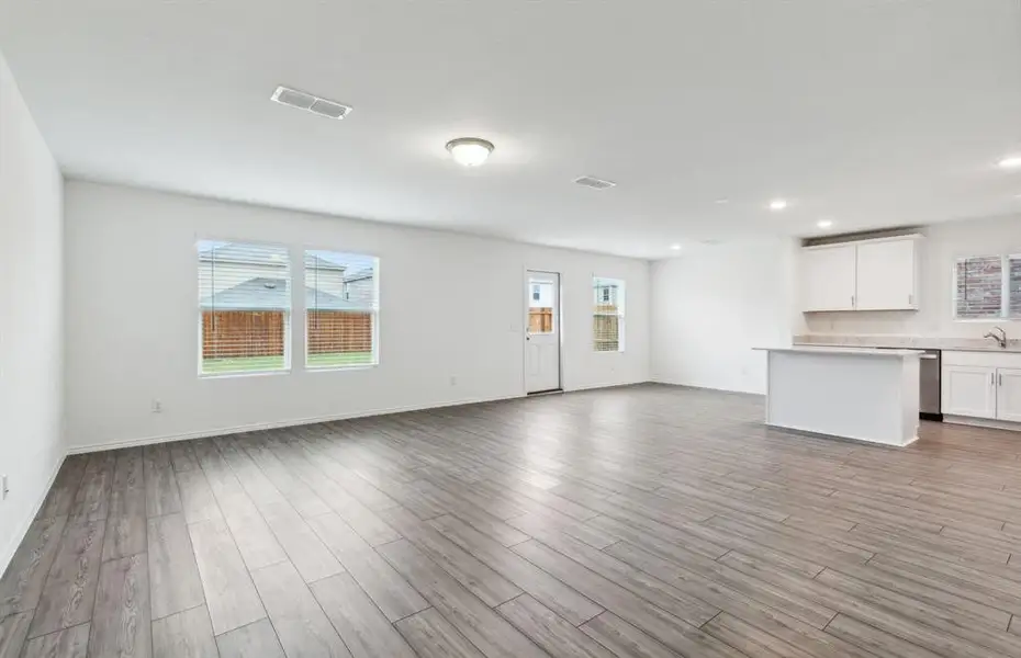 Airy gathering room with large windows *real home pictured