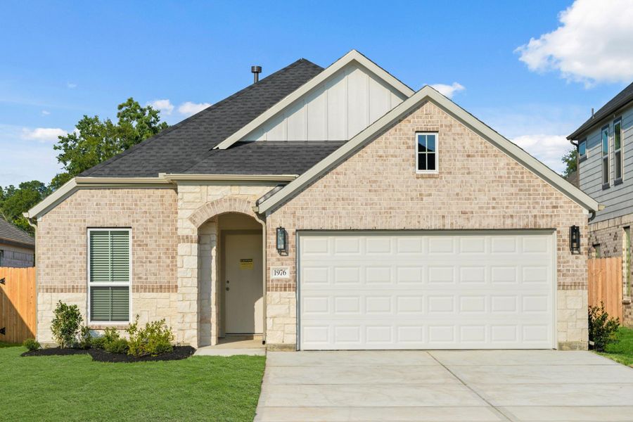 Front exterior of a new home in Barton Creek Ranch, Conroe, TX, highlighting curb appeal (Image 13). Front exterior of a new home in Barton Creek Ranch, Conroe, TX, highlighting curb appeal (Image 13).