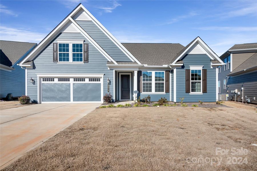 Welcome Home to 8615 Profit Lane!  This nearly new Maple model sits on a premium homesite overlooking a pond.