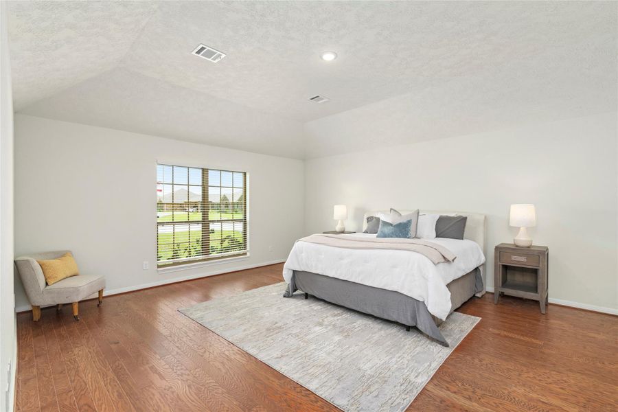 A luxurious primary suite with vaulted ceiling and private sitting area - a lovely homeowners retreat. A luxurious primary suite with vaulted ceiling and private sitting area - a lovely homeowners retreat.
