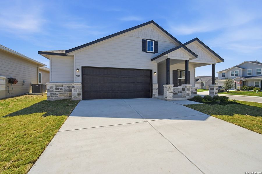 Front exterior of a new home in Swenson Heights, Seguin, TX, highlighting curb appeal (Image 13).