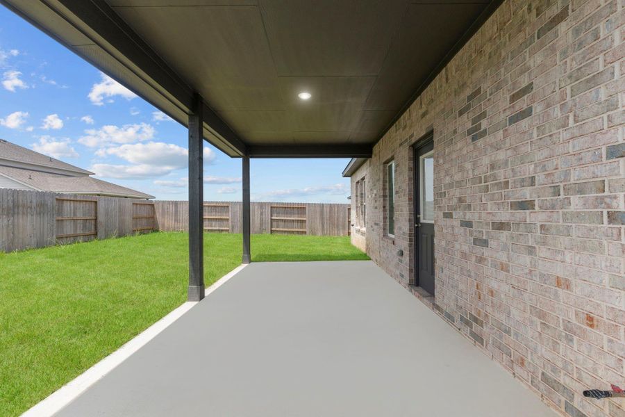 Large covered back patio — perfect for grilling, relaxing, or enjoying your morning coffee in any weather. Large covered back patio — perfect for grilling, relaxing, or enjoying your morning coffee in any weather.