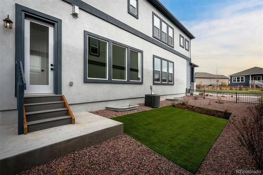 Exterior details and patio area of a home in Revel Crossing at Wolf Ranch – The Outlook Collection, Colorado Springs (Image 4).