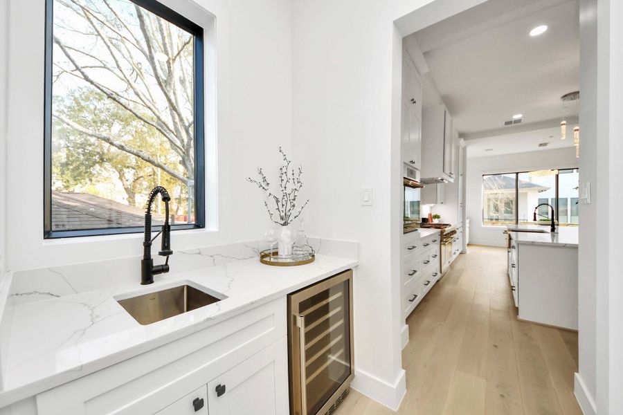 The butler’s pantry provides a refined space for staging, storage, and effortless hosting while keeping everyday clutter out of sight.