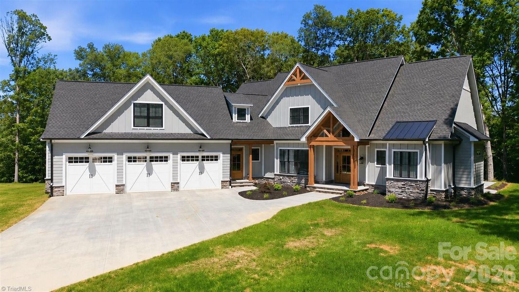 Front exterior of a new home in , Lewisville, NC, highlighting curb appeal (Image 23).