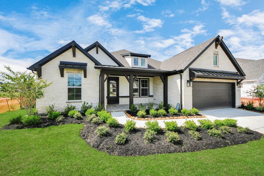 Front exterior of a new home in ARTAVIA: Hilltop Collection, Conroe, TX, highlighting curb appeal (Image 20). Front exterior of a new home in ARTAVIA: Hilltop Collection, Conroe, TX, highlighting curb appeal (Image 20).