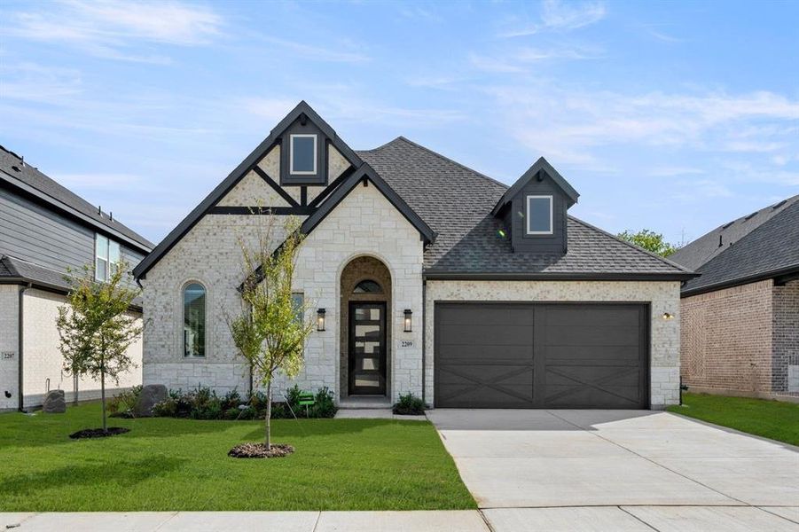 Front exterior of a new home in Birdsong, Mansfield, TX, highlighting curb appeal (Image 2).