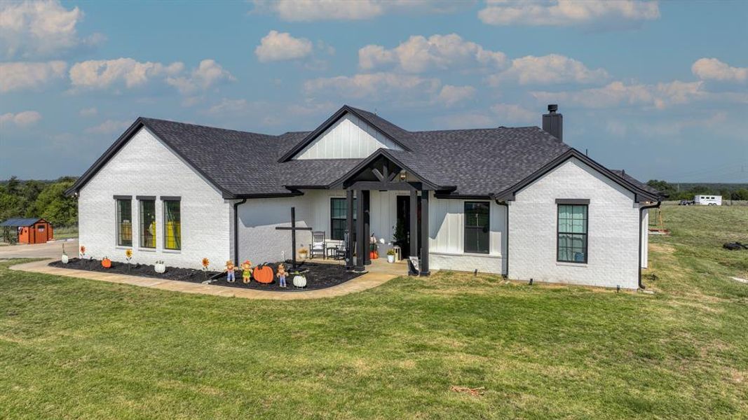 Front exterior of a new home in , Mineral Wells, TX, highlighting curb appeal (Image 19).