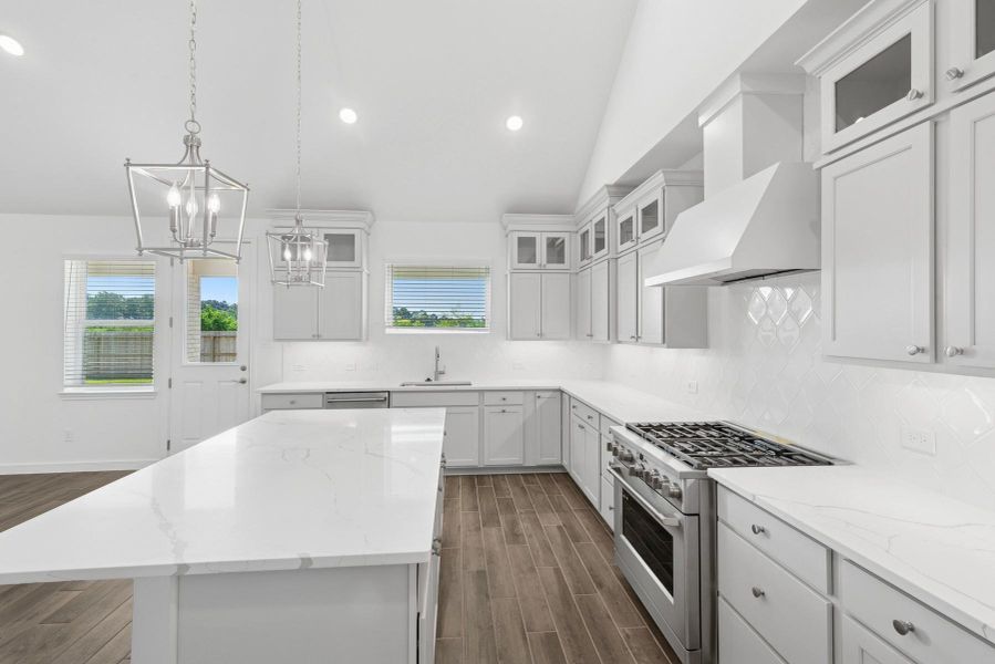 Light grey stacked cabinets and quartz countertops