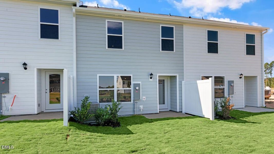 Exterior details and patio area of a home in The Townes at Ridgewood Farms, Winterville (Image 26).