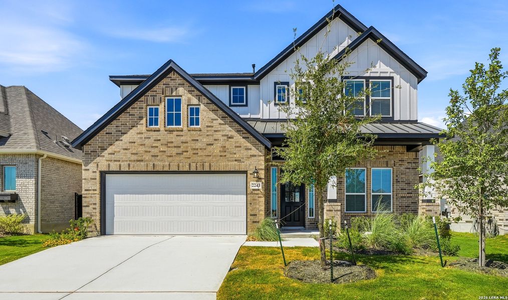 Front exterior of a new home in Prominence Urban, San Antonio, TX, highlighting curb appeal (Image 23).