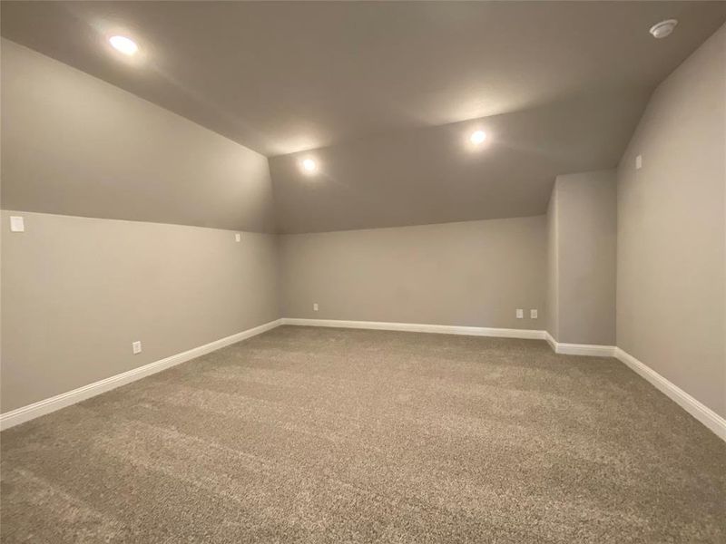 Large media room without windows has prewire for surround sound and is perfect for gaming or watching movies & sports