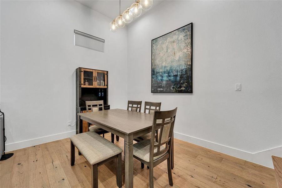 Dining room featuring light wood-style floors and baseboards Dining room featuring light wood-style floors and baseboards