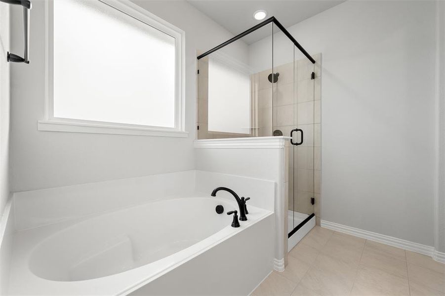 Bathroom featuring a bath, a shower stall, and recessed lighting Bathroom featuring a bath, a shower stall, and recessed lighting