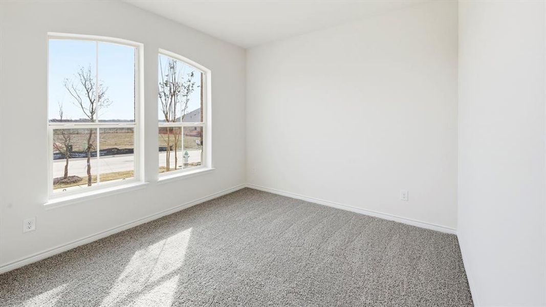 Unfurnished room with light carpet and baseboards