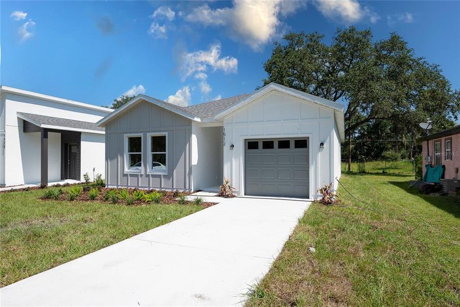 Front exterior of a new home in , Sanford, FL, highlighting curb appeal (Image 22).