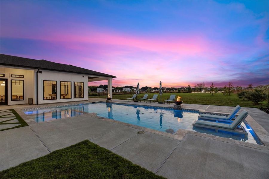 Life is better poolside. You can see just how amazing the backyard view is.