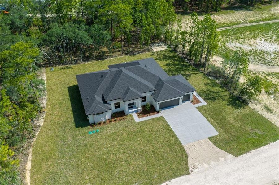 Front exterior of a new home in , Weeki Wachee, FL, highlighting curb appeal (Image 33). Front exterior of a new home in , Weeki Wachee, FL, highlighting curb appeal (Image 33).