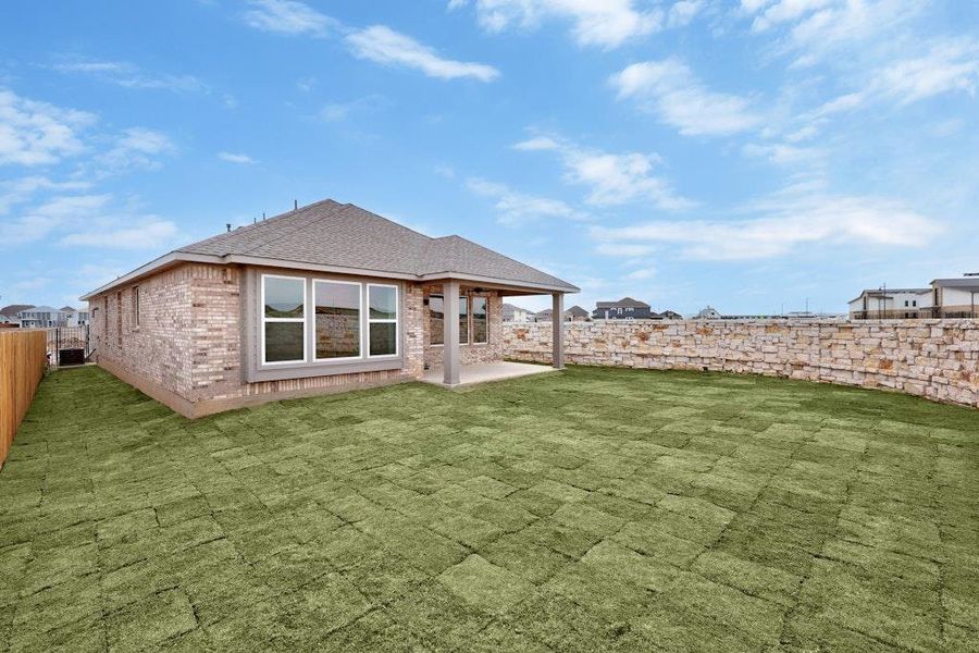 Front exterior of a new home in Santa Rita Ranch, Liberty Hill, TX, highlighting curb appeal (Image 18). Front exterior of a new home in Santa Rita Ranch, Liberty Hill, TX, highlighting curb appeal (Image 18).