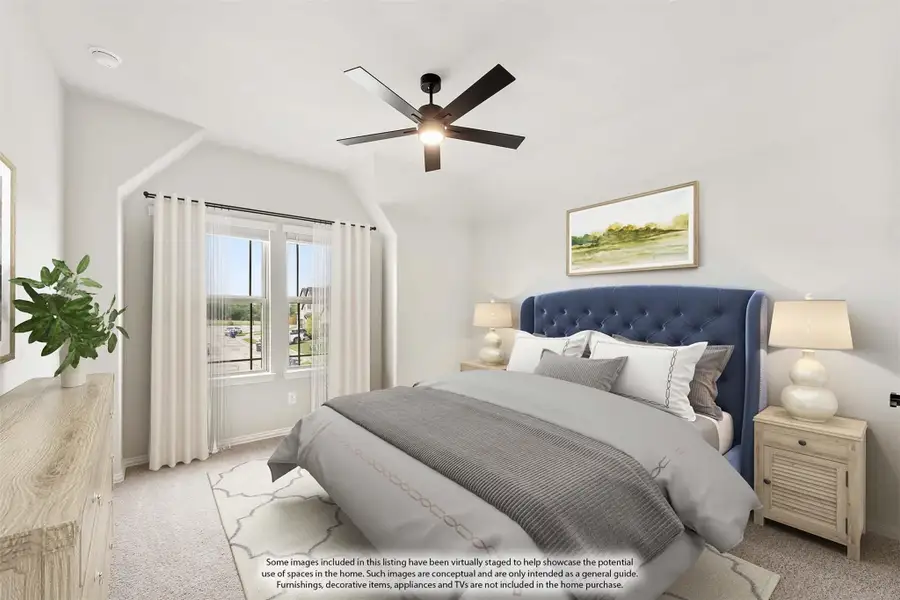 Bedroom with vaulted ceiling, ceiling fan, blue upholstered bed, and large window with natural light Bedroom with vaulted ceiling, ceiling fan, blue upholstered bed, and large window with natural light