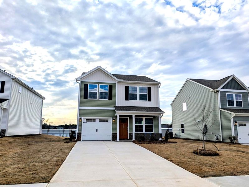 Front exterior of a new home in Tucker Ridge, Pendleton, SC, highlighting curb appeal (Image 1). Front exterior of a new home in Tucker Ridge, Pendleton, SC, highlighting curb appeal (Image 1).
