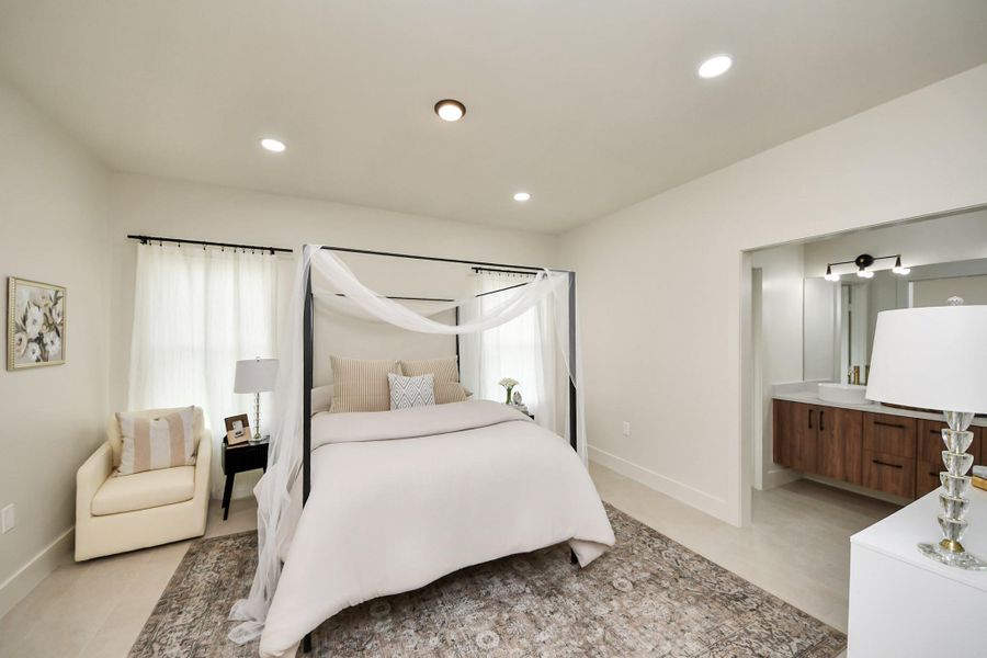 A true sanctuary—the primary suite offers generous space and soft natural light.