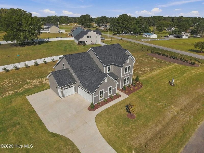 Front exterior of a new home in Dixon Grove, Grimesland, NC, highlighting curb appeal (Image 27).