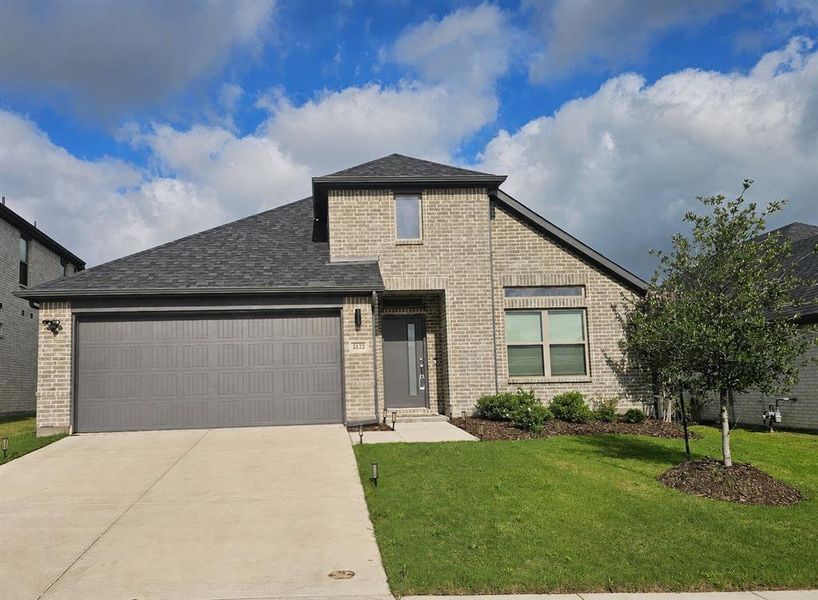 Front exterior of a new home in Devonshire, Forney, TX, highlighting curb appeal (Image 1). Front exterior of a new home in Devonshire, Forney, TX, highlighting curb appeal (Image 1).