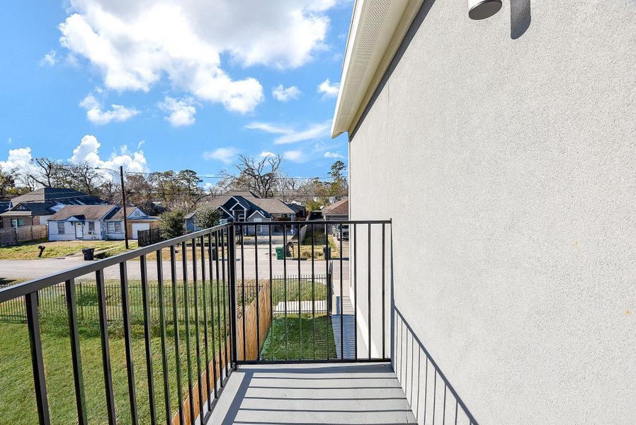 Step onto your private balcony and enjoy a breath of fresh air! Featuring a sleek wrought iron railing and ample space to unwind, this serene outdoor retreat is perfect for morning coffee or evening relaxation.