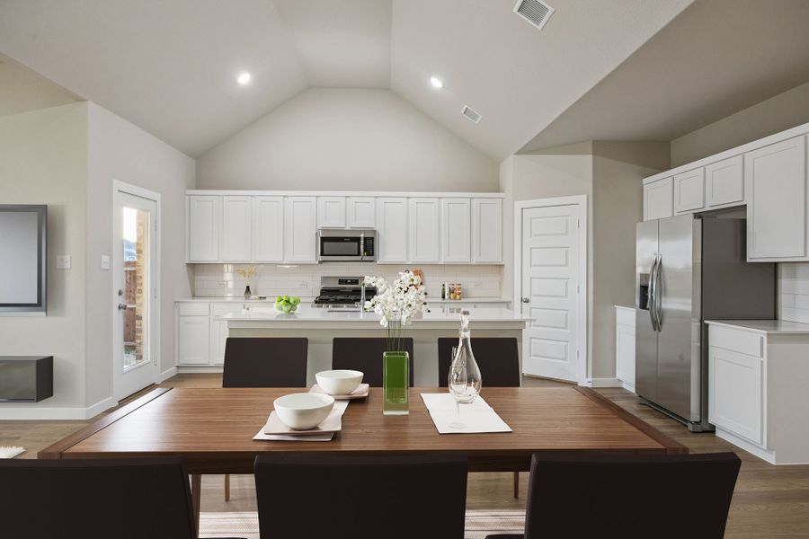 Kitchen in the Wimbledon home plan by Trophy Signature Homes – REPRESENTATIVE PHOTO