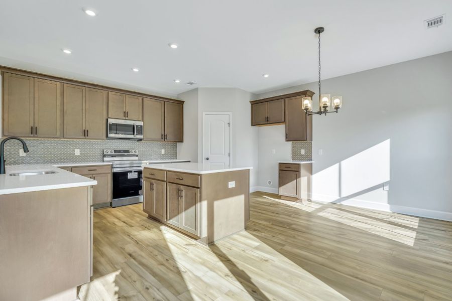 Edisto Kitchen with Wood Cabinetry and Raised Snack Bar