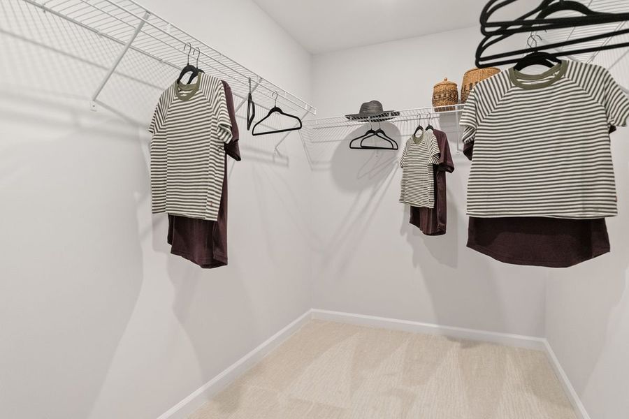 Walk-in closet at primary suite