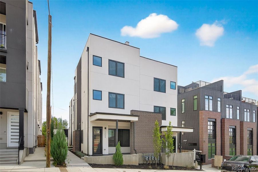 Front exterior of a new home in , Denver, CO, highlighting curb appeal (Image 1).