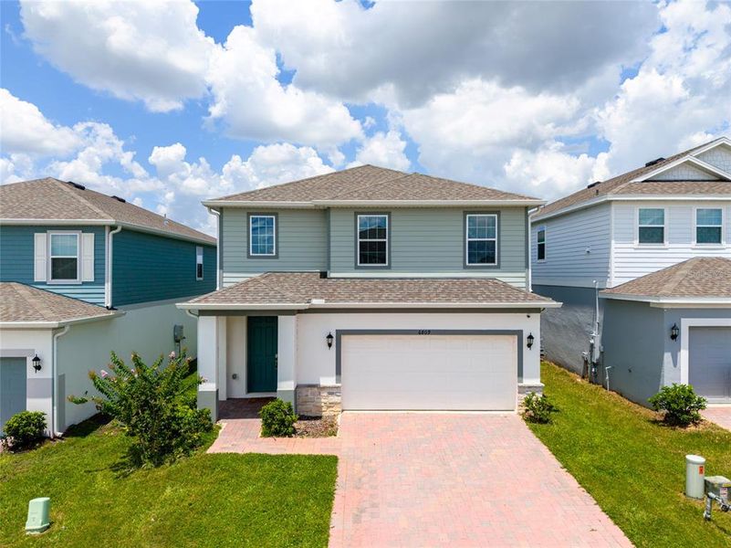 Front exterior of a new home in , Howey-in-the-Hills, FL, highlighting curb appeal (Image 26).