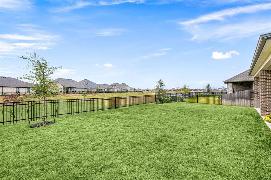 Spacious backyard with water views