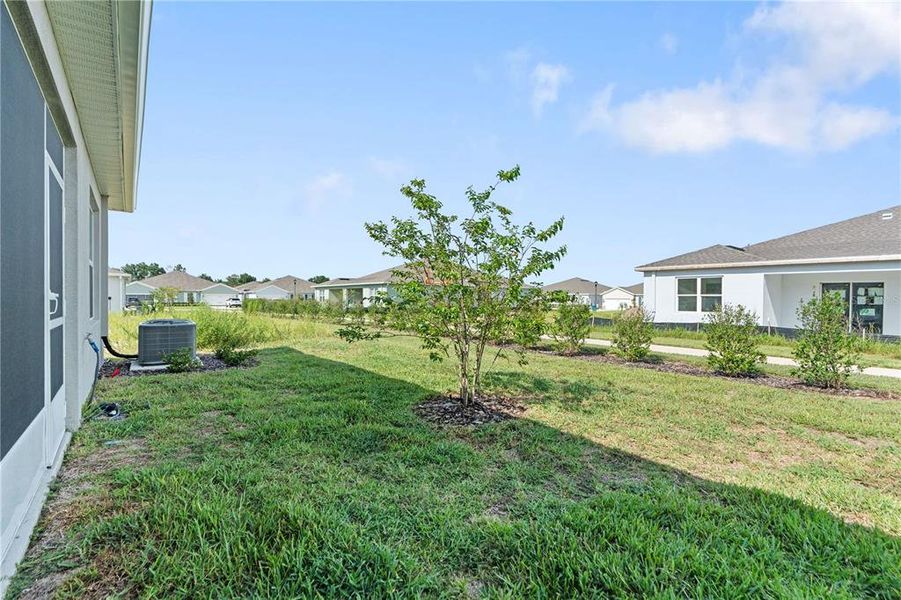 Front exterior of a new home in Park Ridge Villas, Spring Hill, FL, highlighting curb appeal (Image 1).
